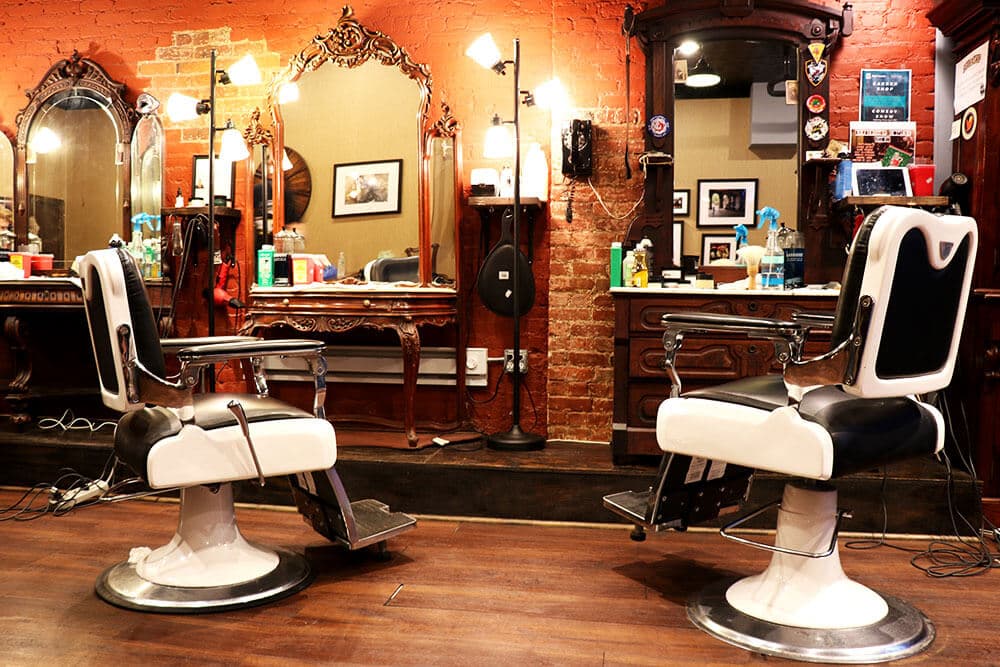 Classic barber chairs against exposed brick